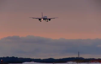 Twilight view & Two Airplanes landing and taking off at Akita Airport in Winter