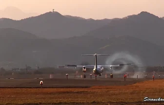 ANA Wings Bombardier DHC-8-Q400 Land & Swirl of smoke at Sendai Airport
