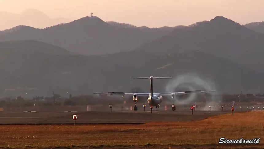 ANA Wings Bombardier DHC-8-Q400 Land & Swirl of smoke at Sendai Airport