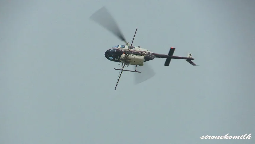Aerobatic Pesticide spraying of helicopter