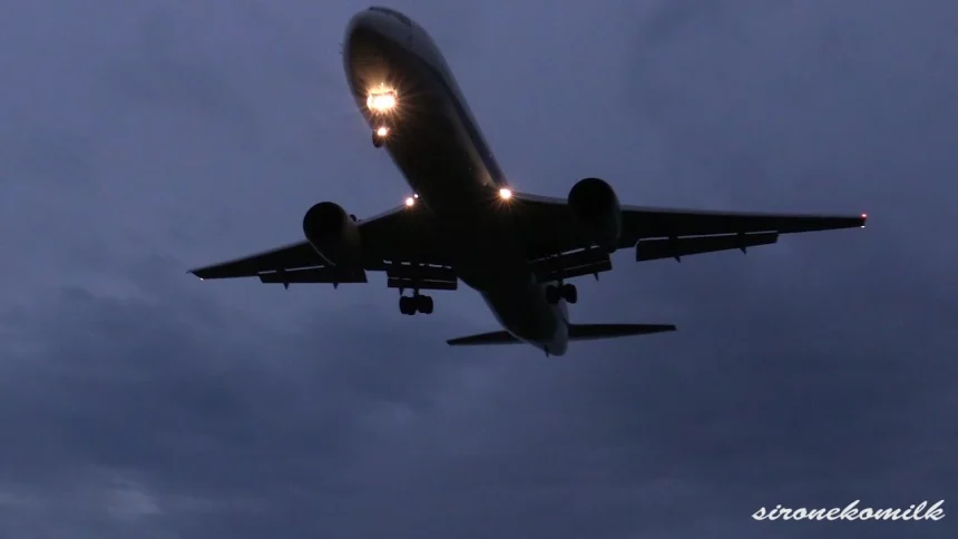 Night Plane Spotting at Sendai Airport. generating a Vapour from the Plane's Wing.